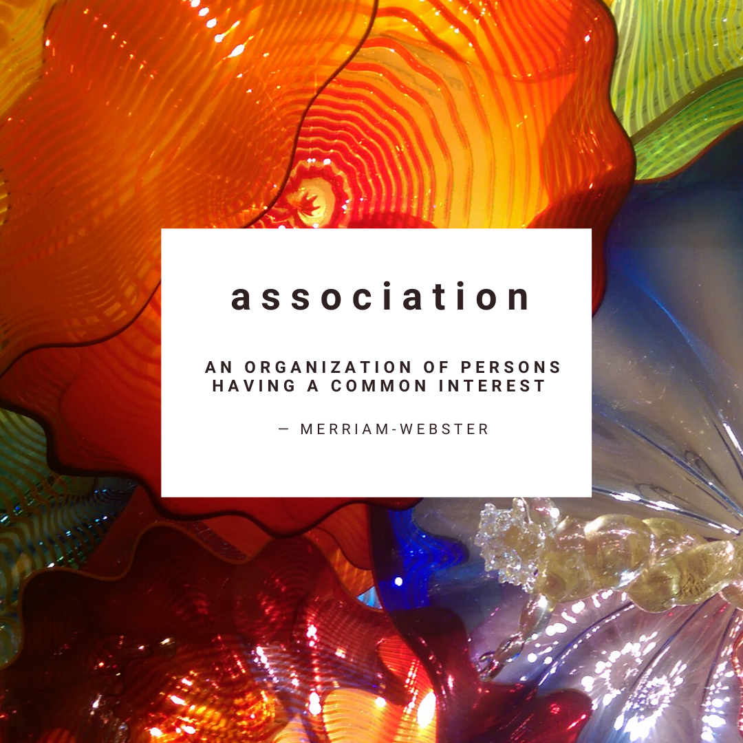 Association definition by Merriam Webster text on background image Chihuly glass ceiling in Seattle